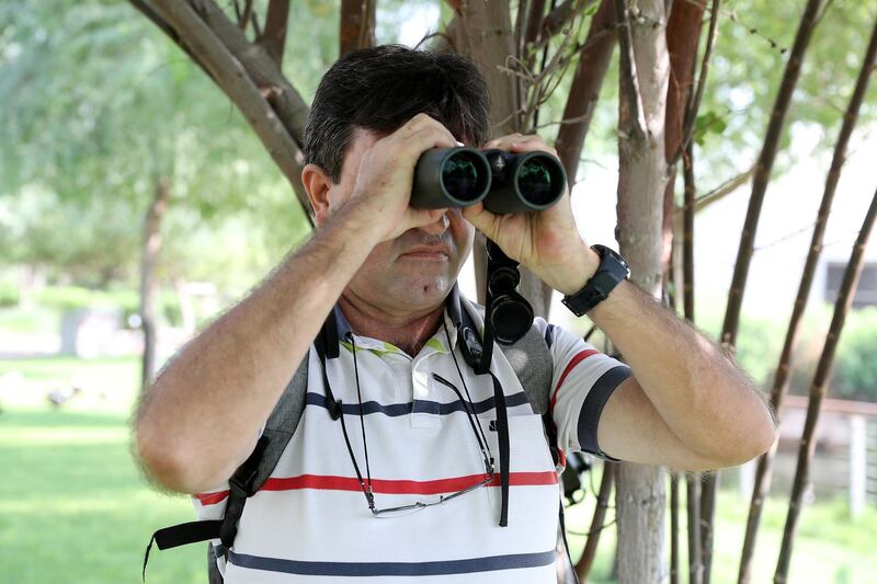DUBAI, UNITED ARAB EMIRATES , October 5 – 2020 :- Judas Jacky, Manager and Scientific Advisor, EWS, WWF watching the birds at The Sustainable City in Dubai. (Pawan Singh / The National) For News/Online. Story by Kelly