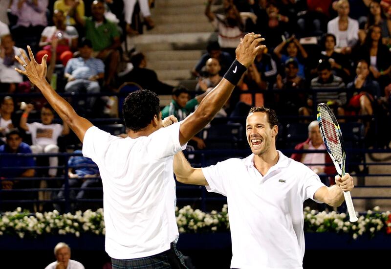 Michael Llodra of France, left, and teammate Mahesh Bhupathi of India celebrate their doubles win against Robert Lindstedt of Sweden and Nenad Zimonjic of Serbia in the Dubai Duty Free Tennis Championships in Dubai, United Arab Emirates, Saturday, March. 2, 2013. (AP Photo/Regi Varghese) *** Local Caption ***  Mideast Emirates Dubai Tennis Championships.JPEG-0ecd1.jpg