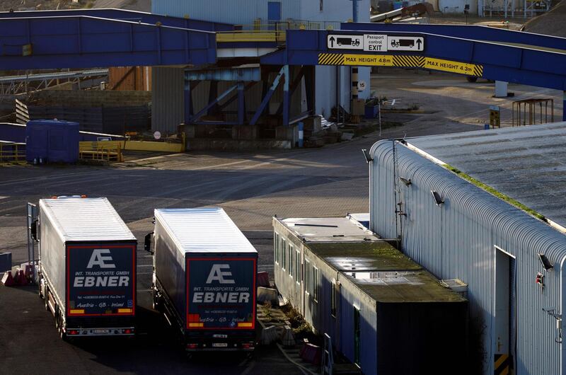 Parked lorries sit near a sign directing freight traffic arriving from Europe towards Passport Control at the Port of Ramsgate in Ramsgate, south east England on January 8, 2019. In the Port of Ramsgate, dredging is under way to prepare the harbour for use in case of delays at the Port of Dover after March 29, the date the UK is set to leave the European Union.
 / AFP / Tolga Akmen / Tolga Akmen
