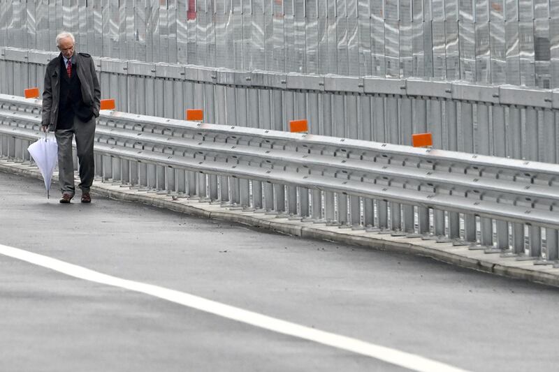 Italian architect Renzo Piano walks on the new San Giorgio bridge. AFP