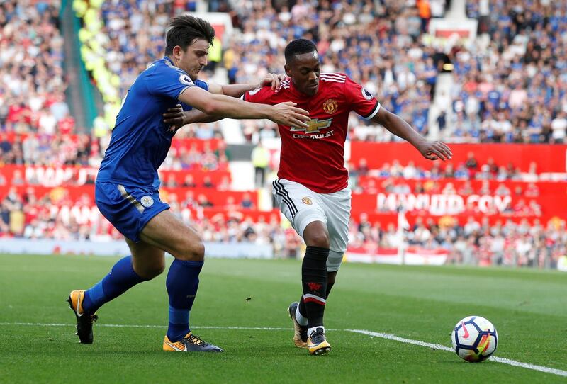Soccer Football - Premier League - Manchester United vs Leicester City - Manchester, Britain - August 26, 2017   Manchester United's Anthony Martial in action with Leicester City's Harry Maguire   REUTERS/Andrew Yates    EDITORIAL USE ONLY. No use with unauthorized audio, video, data, fixture lists, club/league logos or "live" services. Online in-match use limited to 45 images, no video emulation. No use in betting, games or single club/league/player publications. Please contact your account representative for further details.