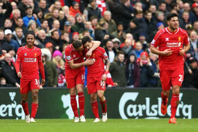 LIVERPOOL, ENGLAND - MARCH 01:  Philippe Coutinho #10 of Liverpool celebrates with teammate Jordan Henderson of Liverpool after scoring his team's second goal during the Barclays Premier League match between Liverpool and Manchester City at Anfield on March 1, 2015 in Liverpool, England.  (Photo by Clive Brunskill/Getty Images)