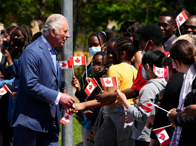 Prince Charles and Camilla, Duchess of Cornwall, visit Assumption Catholic School in Ottawa, while on their 2022 Royal Tour to Canada on Wednesday May 18, 2022. The Canadian Press/AP