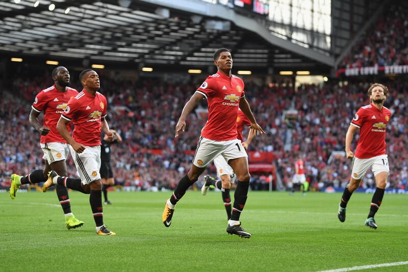 MANCHESTER, ENGLAND - AUGUST 26: Marcus Rashford of Manchester United celebrates scoring his sides first goal with his Manchester United team mates during the Premier League match between Manchester United and Leicester City at Old Trafford on August 26, 2017 in Manchester, England.  (Photo by Michael Regan/Getty Images)