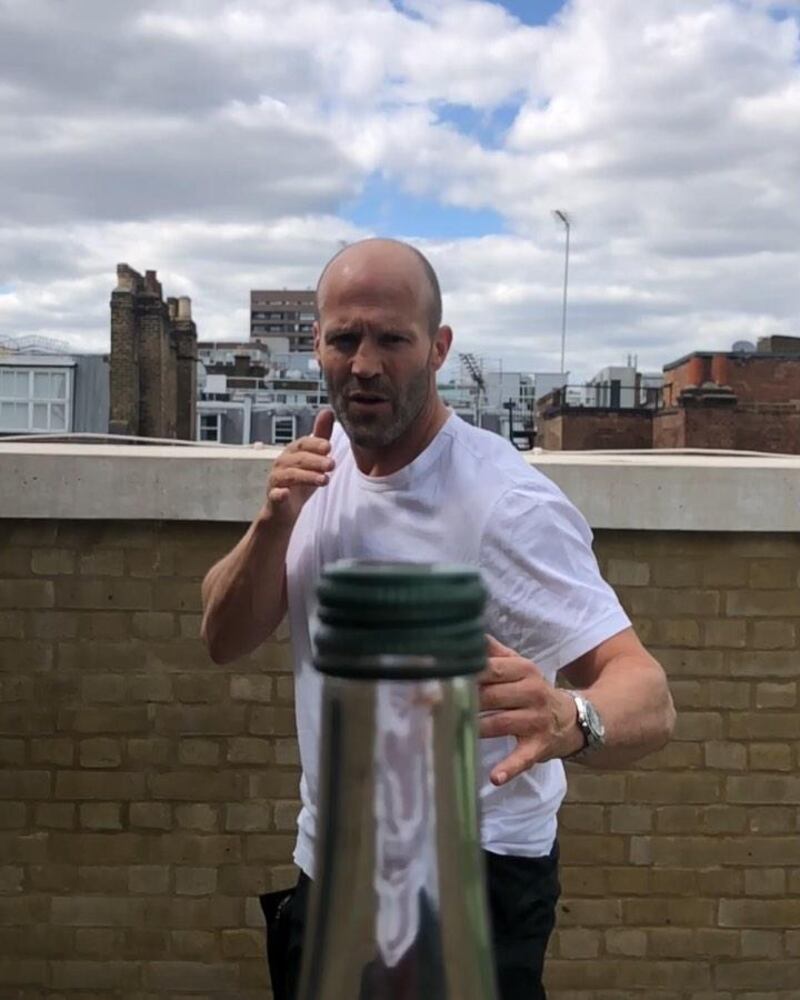 The now-viral challenge sees participants kicking the cap off bottles. Instagram / Jason Statham