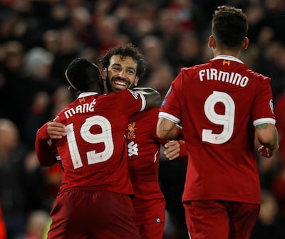 Soccer Football - Champions League Semi Final First Leg - Liverpool vs AS Roma - Anfield, Liverpool, Britain - April 24, 2018   Liverpool's Sadio Mane celebrates scoring their third goal with Mohamed Salah and Roberto Firmino    REUTERS/Phil Noble - RC1E9F88F4C0