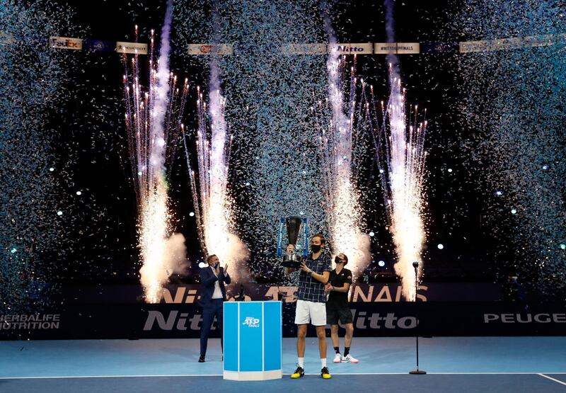 Daniil Medvedev lifts the ATP Finals trophy as he celebrates after winning the final against  Dominic Thiem. Reuters