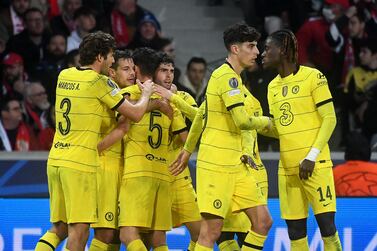 Chelsea's US midfielder Christian Pulisic (C) celebrates with teammates after scoring his team's first goal  during the UEFA Champions League round of 16 second leg football match between Lille (LOSC) and Chelsea FC at the Pierre Mauroy Stadium in Villeneuve-d'Ascq, northern France, on March 16, 2022.  (Photo by FRANCOIS LO PRESTI  /  AFP)
