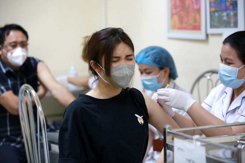 A woman is vaccinated at a hospital in Hanoi. More than 59,000 people in Vietnam have been fully vaccinated against the coronavirus, according to latest official data. EPA