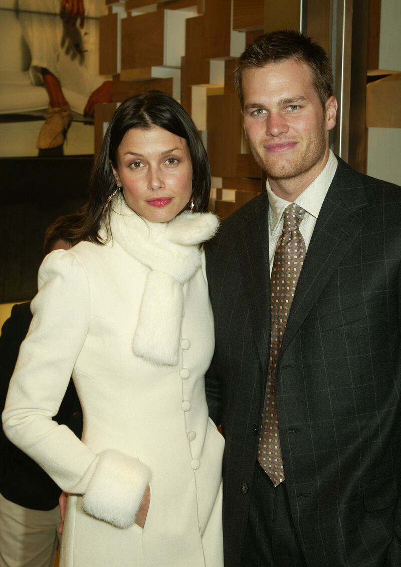 Bridget Moynahan and Brady, in a grey checked Zegna suit, attend the Ermenegildo Zegna flagship store opening April 13, 2004, in New York City. Getty
