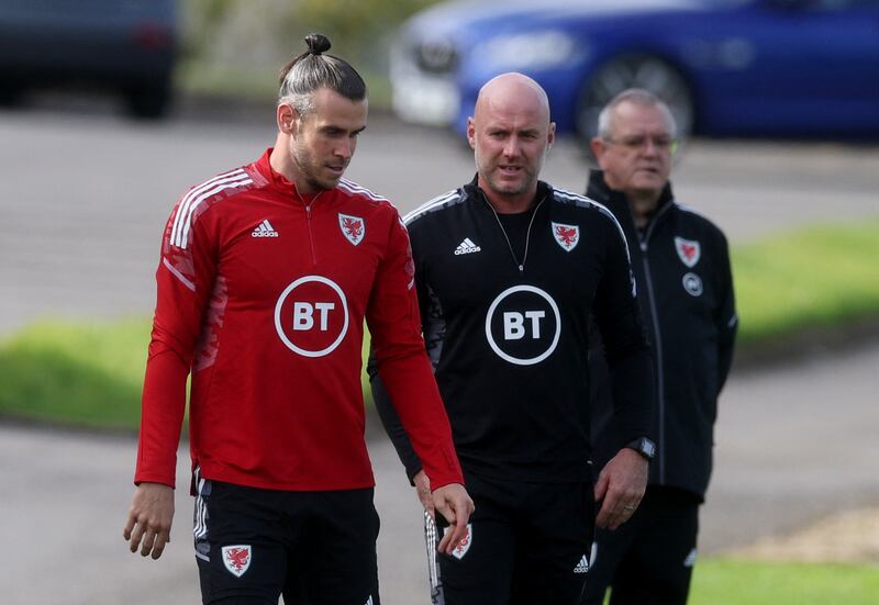 Wales manager Rob Page with Gareth Bale during training. Reuters