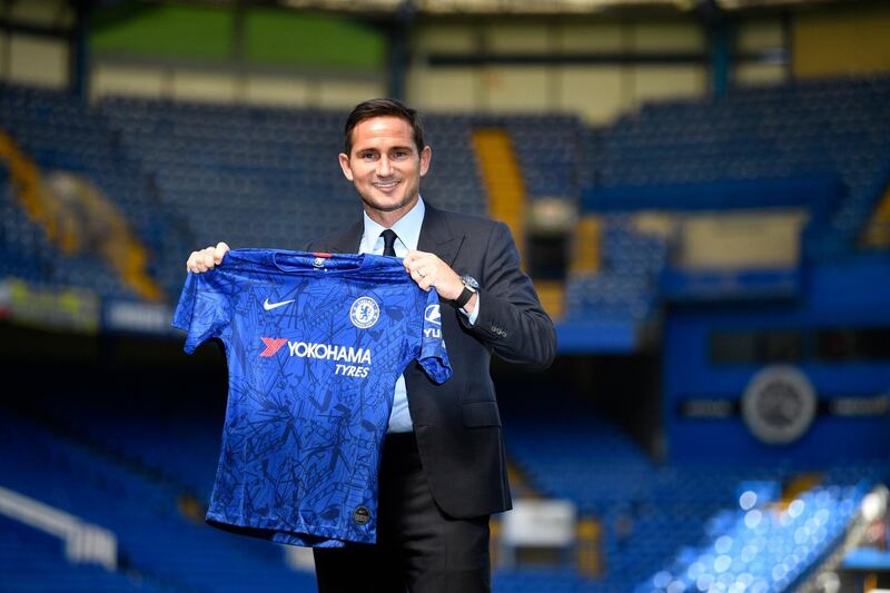 epa07694864 Frank Lampard holds a Chelsea's jersey after attending a press conference at Stamford Bridge in London, Britain, 04 July 2019. The former Chelsea player was announced as Chelsea Football Club's new head coach.  EPA/NEIL HALL