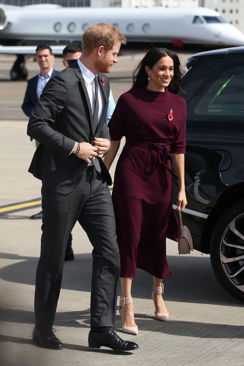 Meghan, Duchess of Sussex, wears a Hugo Boss dress and Aquazzura heels in Sydney on October 28, 2018. AFP