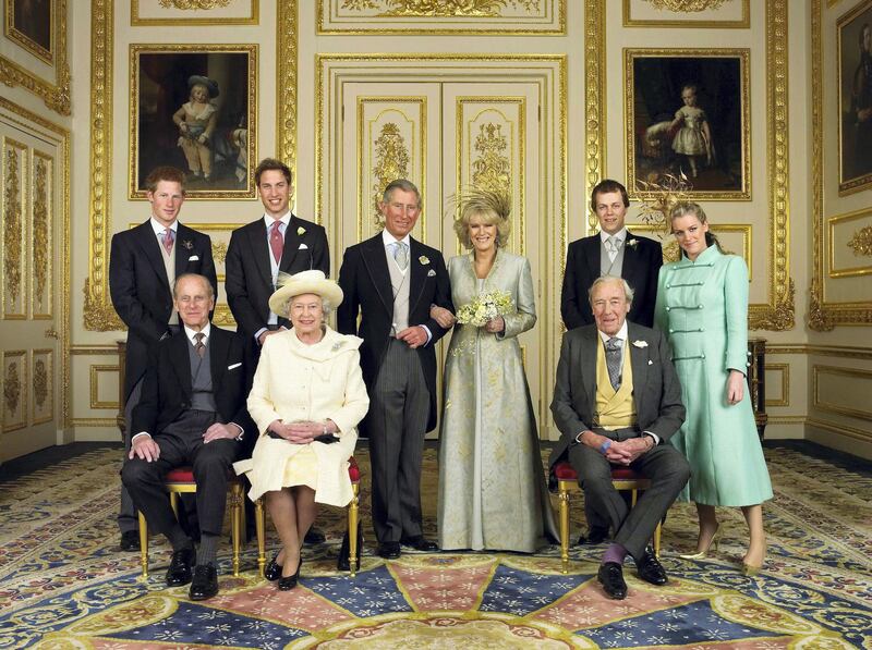 (EMBARGOED TO 0001 BST MONDAY APRIL 11 2005) WINDSOR, ENGLAND - APRIL 9: Clarence House official handout photo of the Prince of Wales and his new bride Camilla, Duchess of Cornwall, with their families (L-R back row) Prince Harry, Prince William, Tom and Laura Parker Bowles (L-R front row) Duke of Edinburgh, Britain's Queen Elizabeth II and Camilla's father Major Bruce Shand, in the White Drawing Room at Windsor Castle after their wedding ceremony, April 9, 2005 in Windsor, England. (Photo by Hugo Burnand/Pool/Getty Images) 