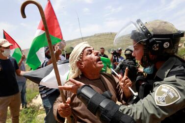 A Palestinian man argues with an Israeli border policewoman during a protest marking the 72nd anniversary of Nakba in the village of Sawiya near Nablus in the Israeli-occupied West Bank. Reuters