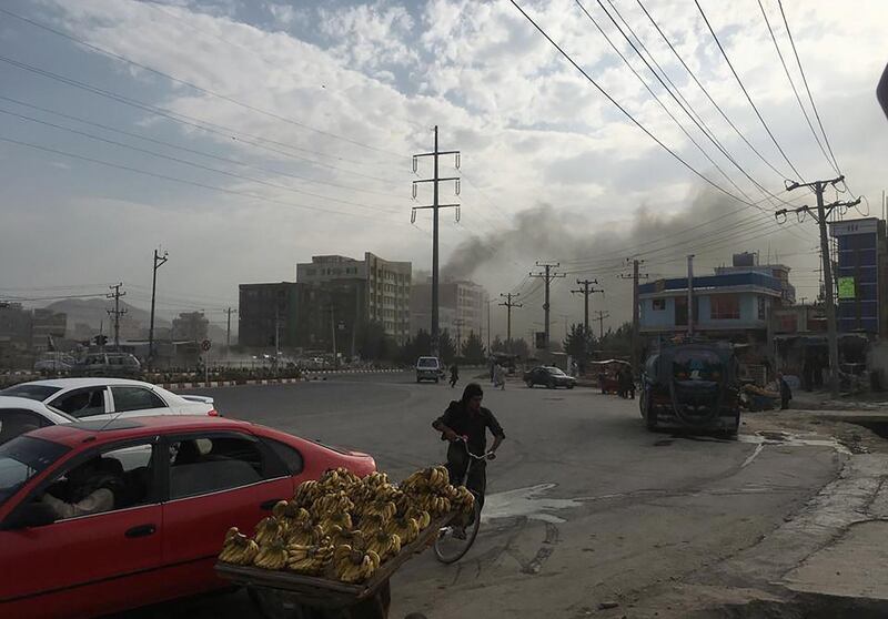 Smoke rises from the site of an attack targeting the Kabul office of the running mate of Afghan President Ashraf Ghani in Kabul. At least one person was killed and 13 others wounded in an attack targeting the Kabul office of the running mate of Afghan President Ashraf Ghani, officials said. AFP