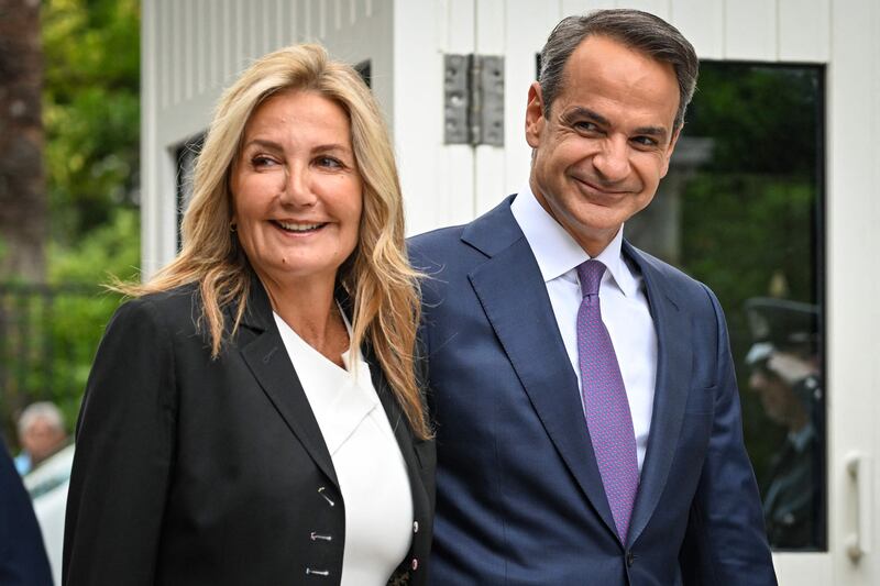 Kyriakos Mitsotakis, right, and his wife Mareva Grabowski-Mitsotakis at the presidential palace on Monday. AFP
