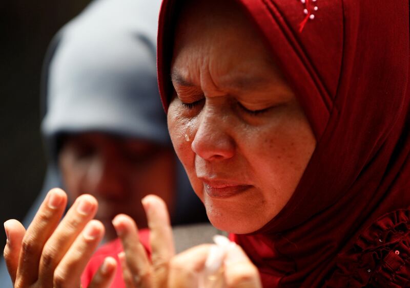 A Muslim woman cries during prayers at the end of a rally in support of the persecuted Rohingya minority  outside the Myanmar embassy in Jakarta, Indonesia. Darren Whiteside / Reuters
