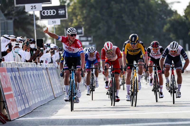 Mathieu van der Poel, of Team Alpecin–Fenix, celebrates as he approaches the finish line to win Stage 1. AFP