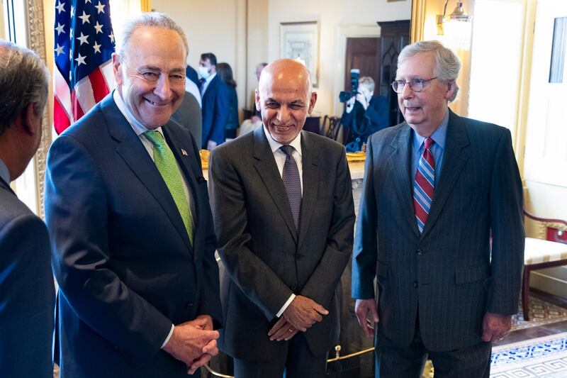 epa09299240 President of Afghanistan Ashraf Ghani (C) is hosted by Senate Majority Leader Chuck Schumer (L) and Senate Minority Leader Mitch McConnell (R) on Capitol Hill, in Washington, DC, USA, 24 June 2021.  EPA/MICHAEL REYNOLDS