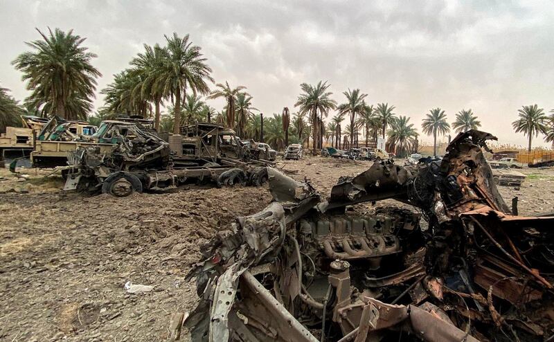 Damaged military vehicles in the aftermath of US air strikes at a militarised zone in the Jurf Al Sakhr area in Iraq's Babylon province controlled by Kataib Hezbollah. AFP