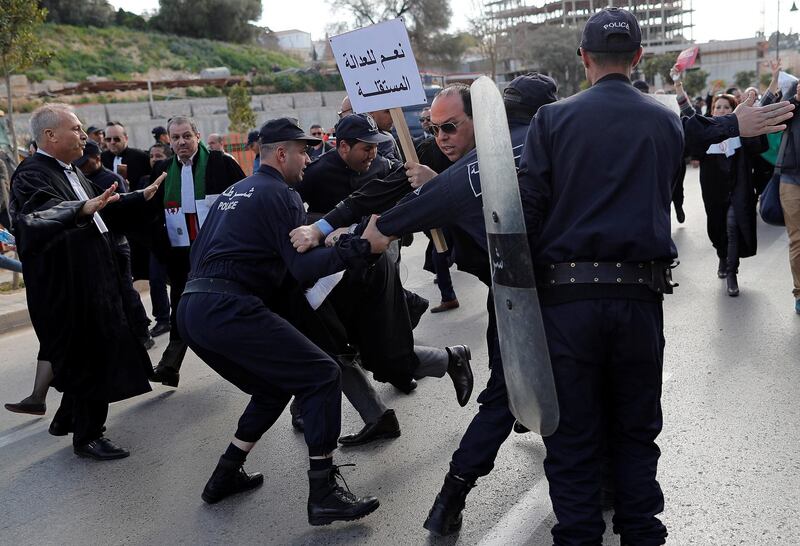 Police attempt to disperse lawyers trying to force their way to the constitutional council during a protest to denounce President Abdelaziz Bouteflika's plans to run in elections next month but not to serve a full term if re-elected, in Algiers, Algeria. Reuters