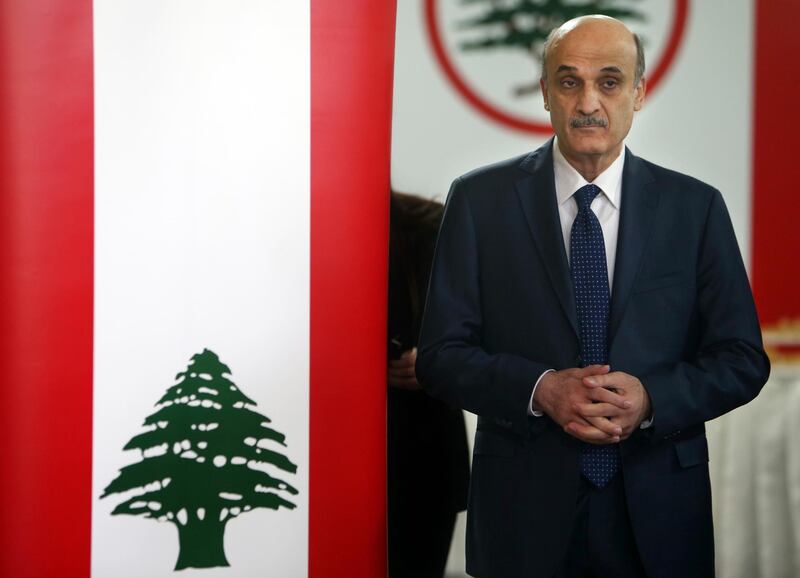 FILE - In this April 4, 2014 file photo, Samir Geagea, leader of the Christian Lebanese Forces party, enters a hall to meet with his senior party officials to announce his candidacy for the Lebanese presidency, in Maarab east Beirut, Lebanon. Geagea told The Associated Press on Tuesday, July 28, 2020 that he blamed the militant group Hezbollah and its allies led by the country's president for the rapidly deteriorating economy and Lebanonâ€™s worsening relations with Arab countries. He says the only solution is for them to leave power. (AP Photo/Hussein Malla, File)