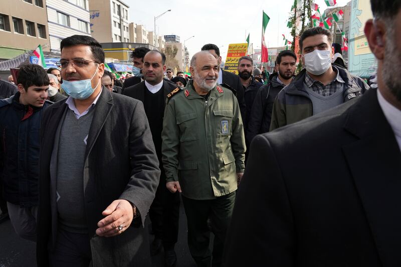 The chief of Iran's Islamic Revolutionary Guard Corps Hossein Salami, centre, takes part in the events in Tehran. AP