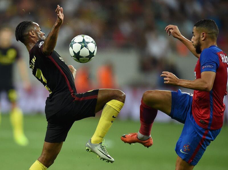 Raheem Sterling vies for the ball with Steaua Bucharest's Jugurtha Hamroun. (AFP)