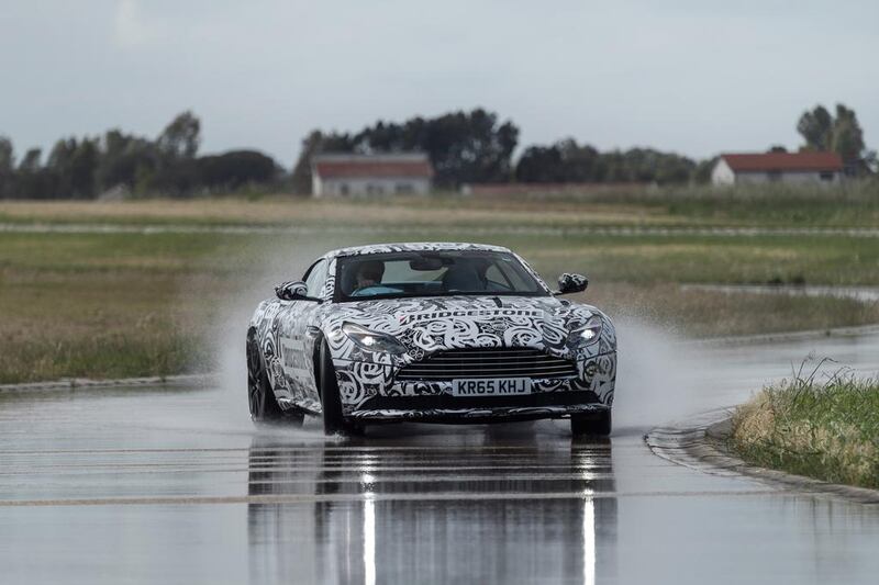A camouflaged pre-production example of the new Aston Martin DB11 being put through its paces during testing at Bridgestone’s proving ground near Rome. Courtesy Aston Martin Lagonda
