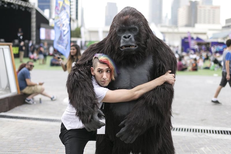 Max Landis cuddles a gorilla.