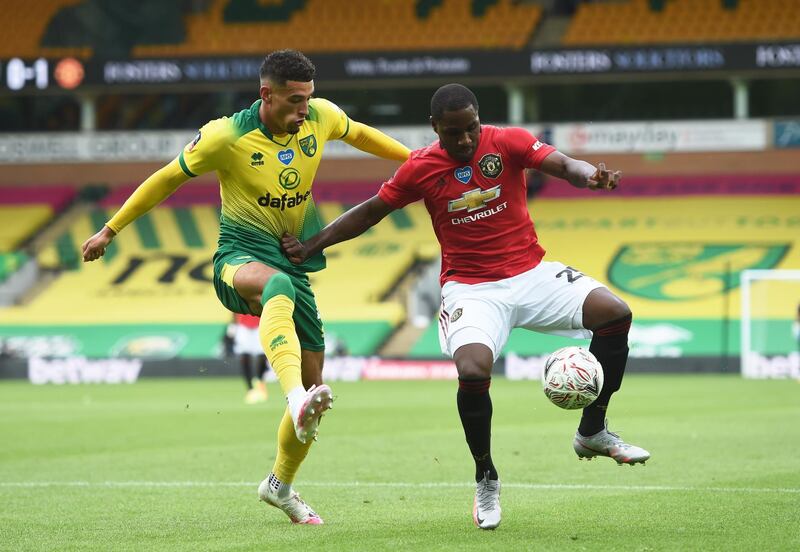 United's Odion Ighalo under pressure from Ben Godfrey of Norwich. Reuters