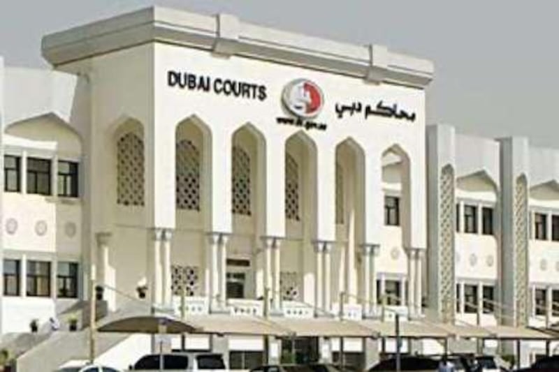 Dubai Court of First Instance. A services agent today admitted forging signatures on dozens of employment visas.