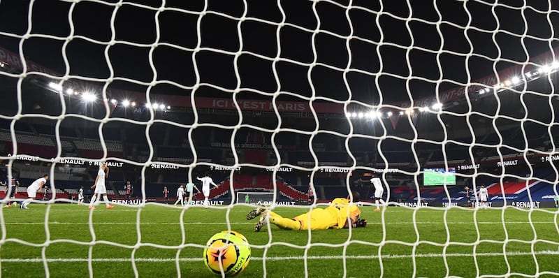 Paris Saint-Germain's Argentine midfielder Angel Di Maria scores the third goal past Rennes' Senegalese goalkeeper Alfred Gomis. AFP