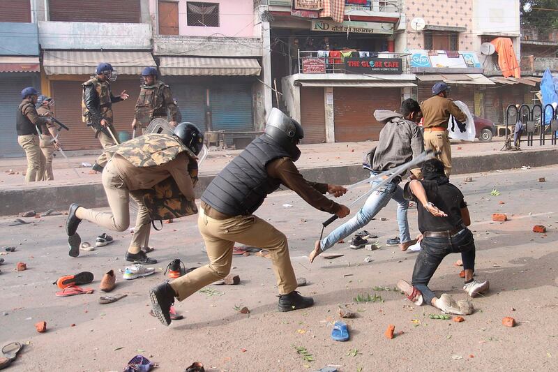Police clash with protesters during demonstrations against India's new citizenship law in Lucknow on December 19, 2019. Indians defied bans on assembly on December 19 in cities nationwide as anger swells against a citizenship law seen as discriminatory against Muslims, following days of protests, clashes and riots that have left six dead. AFP