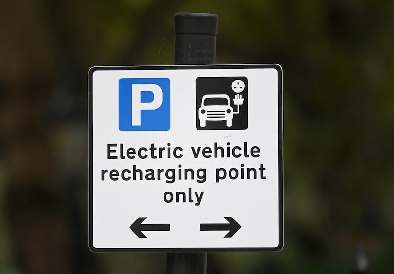 An electric vehicle charging station sign. Reuters