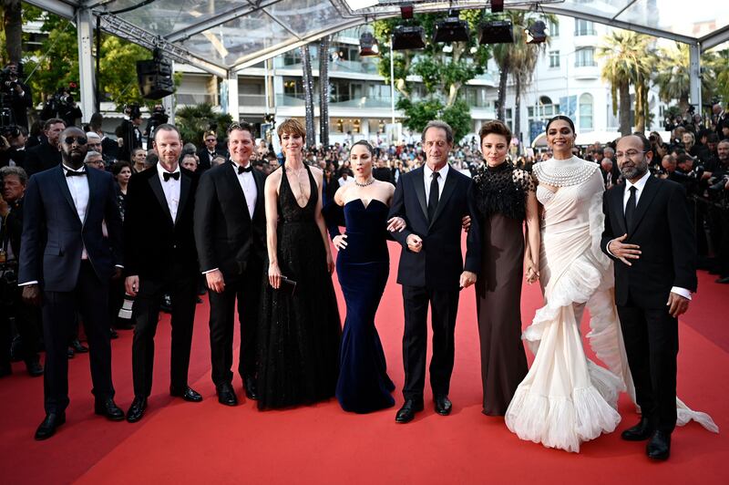 French actor and President of the Jury of the 75th Cannes Film Festival Vincent Lindon, fourth right, arrives with, from left, French director Ladj Ly, Norwegian film director Joachim Trier, US film director Jeff Nichols, British actress Rebecca Hall, Swedish actress Noomi Rapace, Italian actress Jasmine Trinca, Indian actress Deepika Padukone and Iranian film director Asghar Farhadi for the closing ceremony of the 75th edition of the Cannes Film Festival. AFP