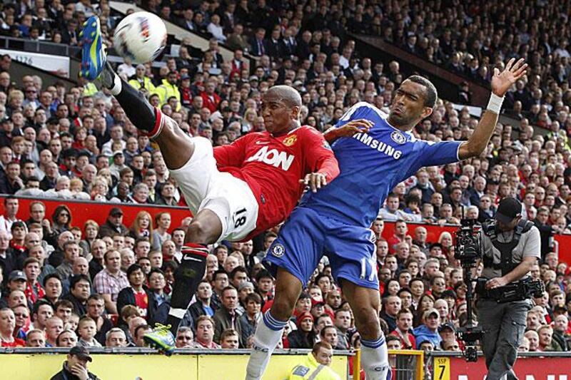 Ashley Young, the Manchester United winger, left, provides the acrobatics to get a cross in against Chelsea. United went on to win the match 3-1.

Phil Noble / Reuters