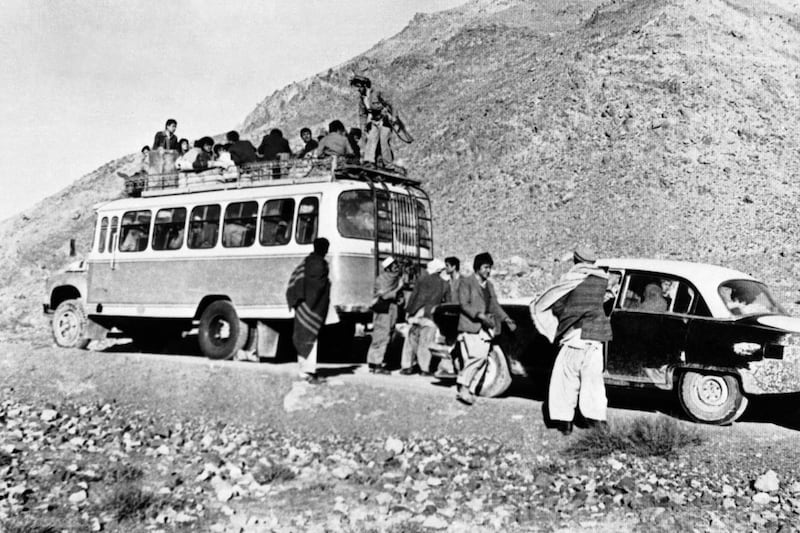 Afghan insurgents search for pro-Soviet regime and party officials among bus passengers in the Panjshir valley, the scene of fierce fighting in January 1981. AP Photo