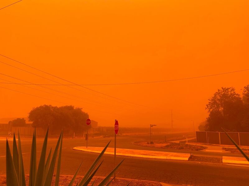 The sky turns orange from dust storms caused by bushfires in Mildura in Victoria state. Petra Johansson / AFP Photo