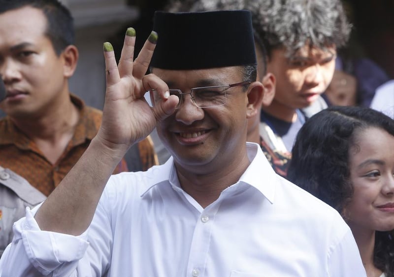 Jakarta gubernatorial candidate Anies Baswedan displays an indelible ink mark on his fingers after voting at a polling station in Jakarta, Indonesia on February 15, 2017. Baswedan, a former education minister, garnered 39 per cent of Wednesday's vote, behind incumbent Basuki Purnama who won 43 per cent of the votes. Adi Weda/ EPA