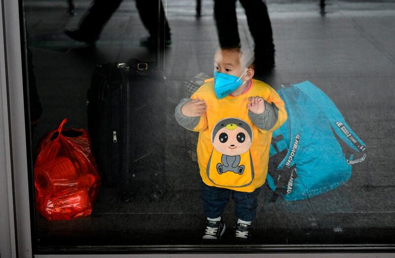 A child wears a protective facemask in a subway in Shanghai. AFP