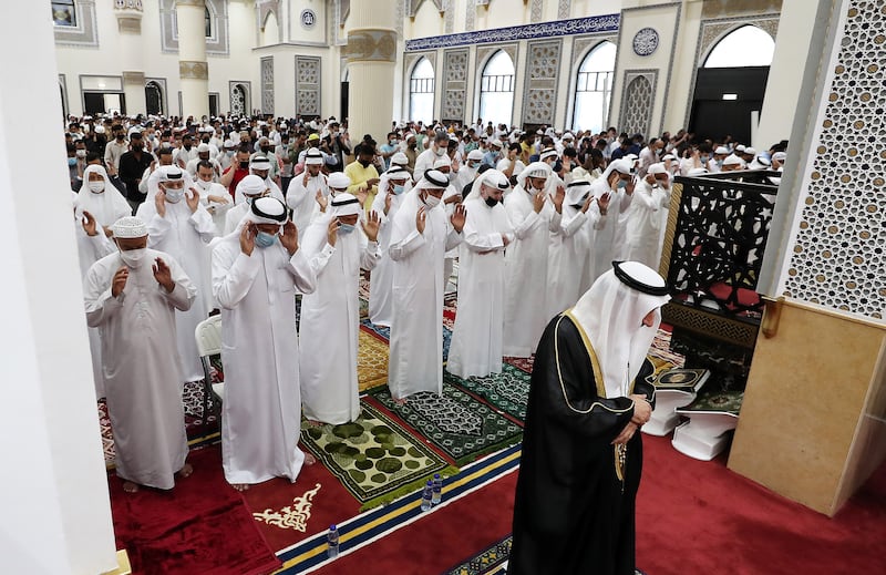 Worshippers perform prayers on the first morning of Eid Al Fitr  at Al Farooq Omar Bin Al Khattab Mosque in Dubai. 
 Pawan Singh / The National