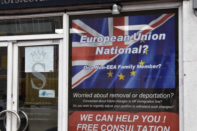 A sign in the window of Solomon Solicitors in Luton, UK. Claire Corkery / The National