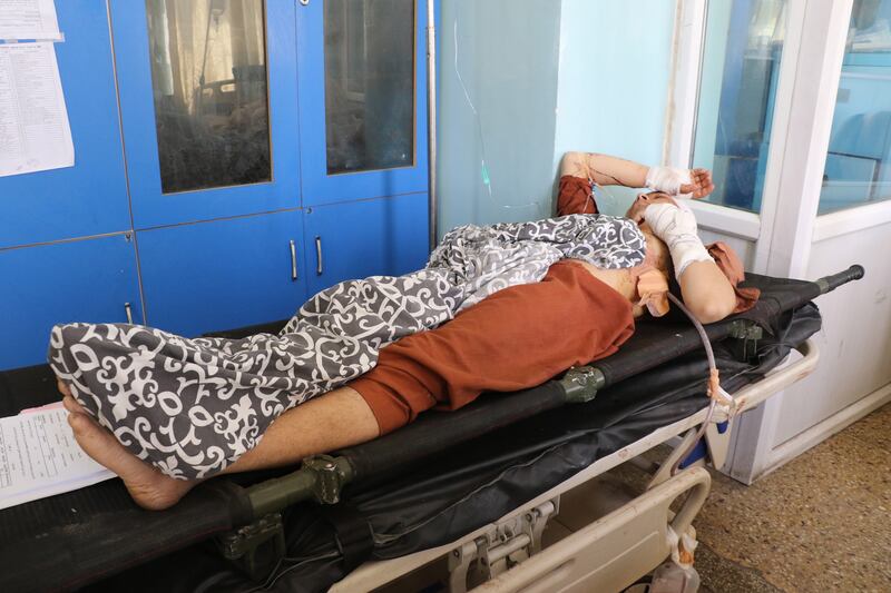 An injured victim waits for hospital treatment. EPA