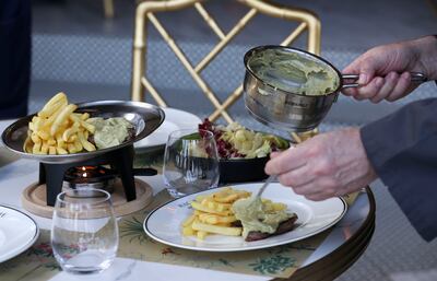 Cafe de Paris steak frites at Raclette Brasserie & Cafe. Khushnum Bhandari / The National 
