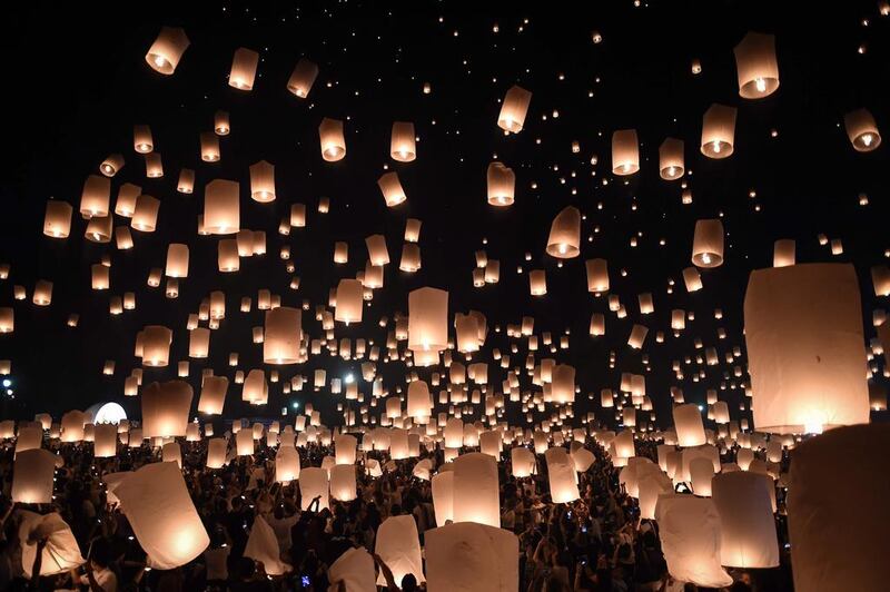 People release thousands of paper lanterns to mark the annual Yi Peng festival in the popular tourist city of Chiang Mai in the north of Thailand. AFP