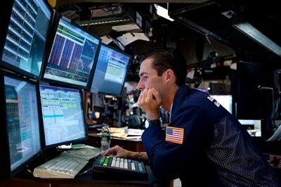 In this Aug. 4, 2011 photo, a trader works on the floor of the New York Stock Exchange. Global stock markets tumbled Friday, Aug. 5, amid fears the U.S. may be heading back into recession and Europe's debt crisis is worsening. The sell-off follows the biggest one-day points decline on Wall Street since the 2008 financial crisis. (AP Photo/Jin Lee) *** Local Caption ***  Wall Street.JPEG-07387.jpg