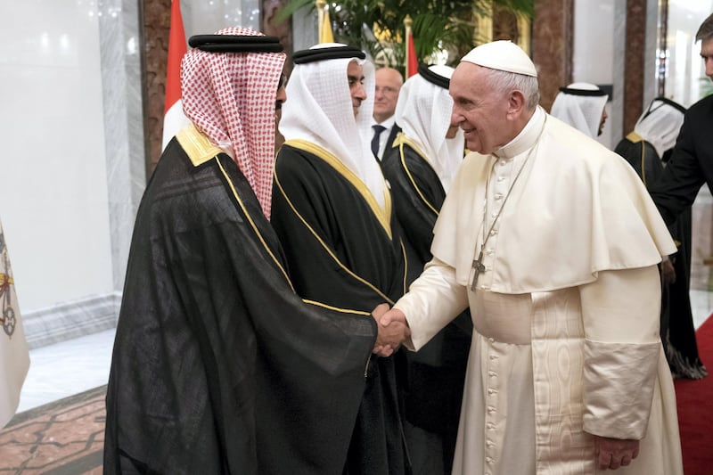 ABU DHABI, UNITED ARAB EMIRATES - February 3, 2019: Day one of the UAE Papal visit - HH Sheikh Tahnoon bin Zayed Al Nahyan, UAE National Security Advisor (L)  greets His Holiness Pope Francis, Head of the Catholic Church (R), at the Presidential Airport. 

( Ryan Carter / Ministry of Presidential Affairs )
---