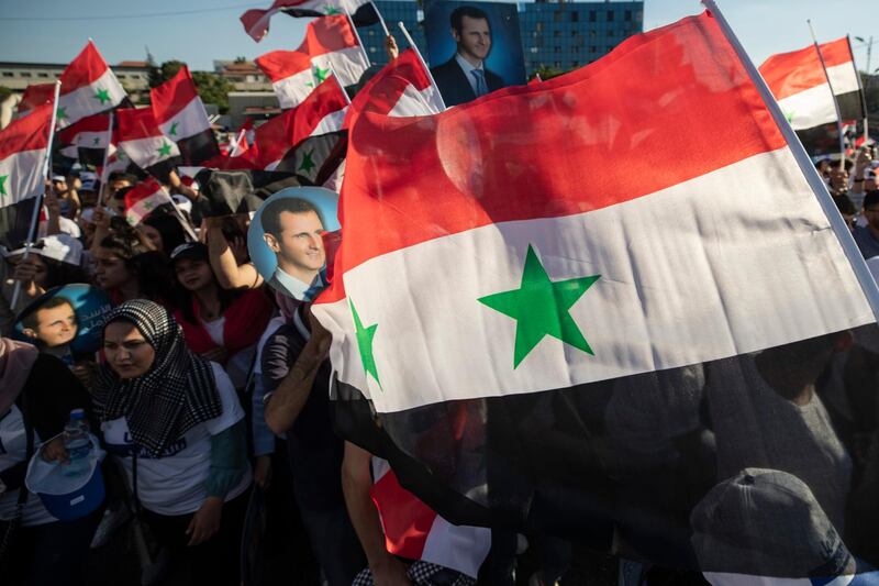 Syrian President Bashar Al Assad will run against two challengers approved by the country's constitutional court in Wednesday's election. AP Photo